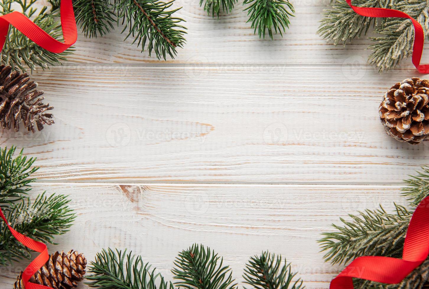 Christmas decoration with red ribbon making a frame with copy space. photo