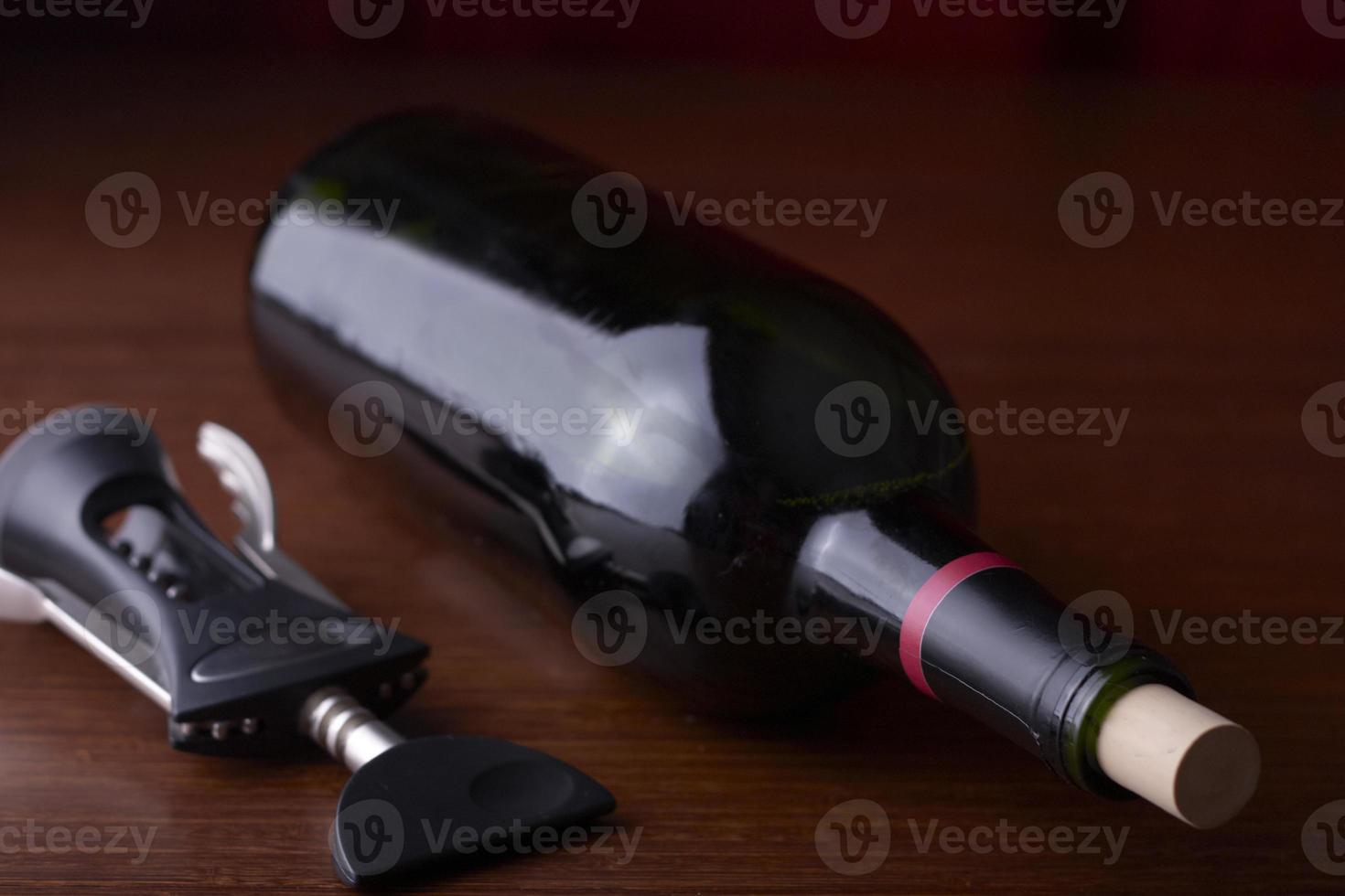 cork screw and a wine bottle photo