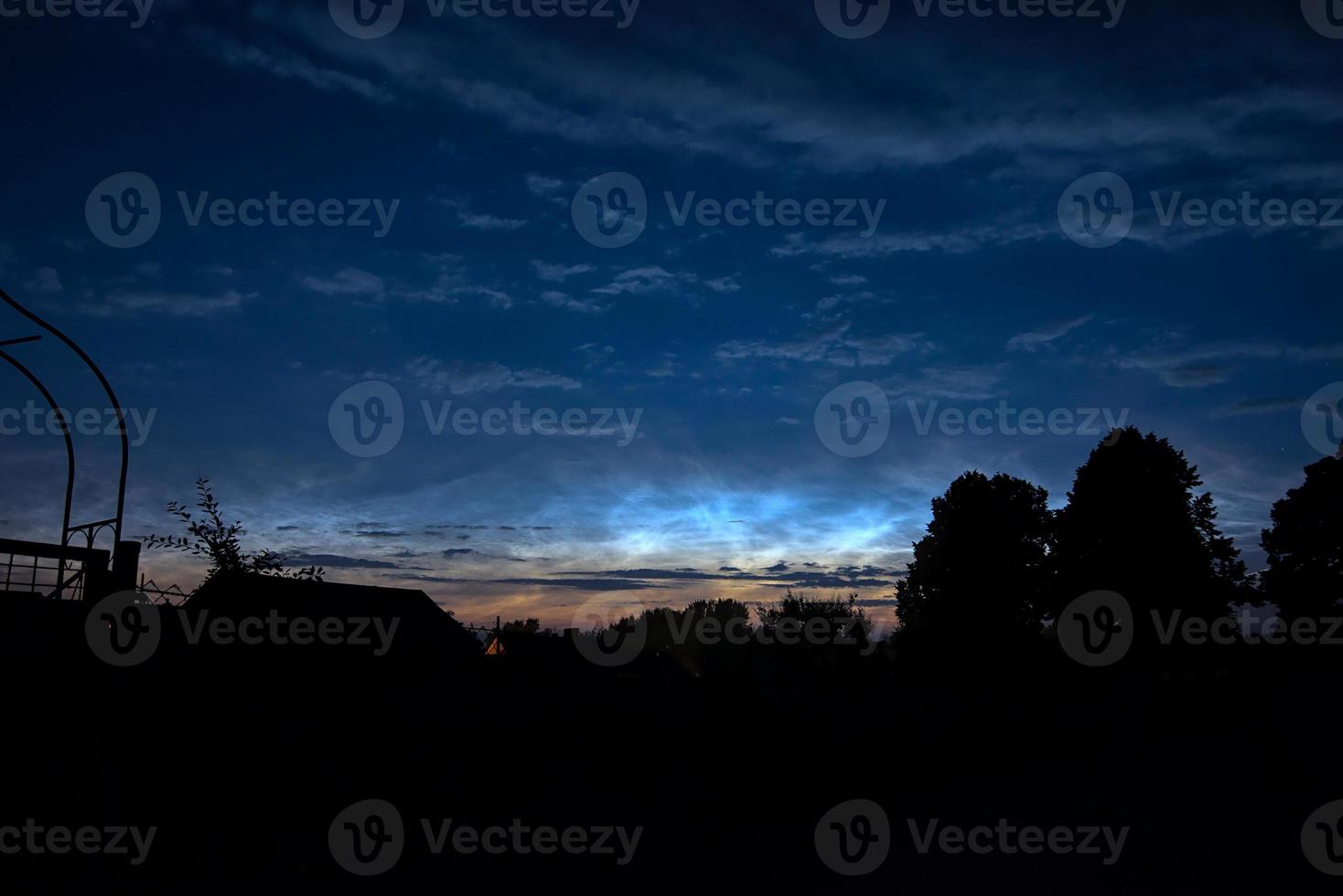strong noctilucent clouds in the dawn over Germany after sunset in the summer photo