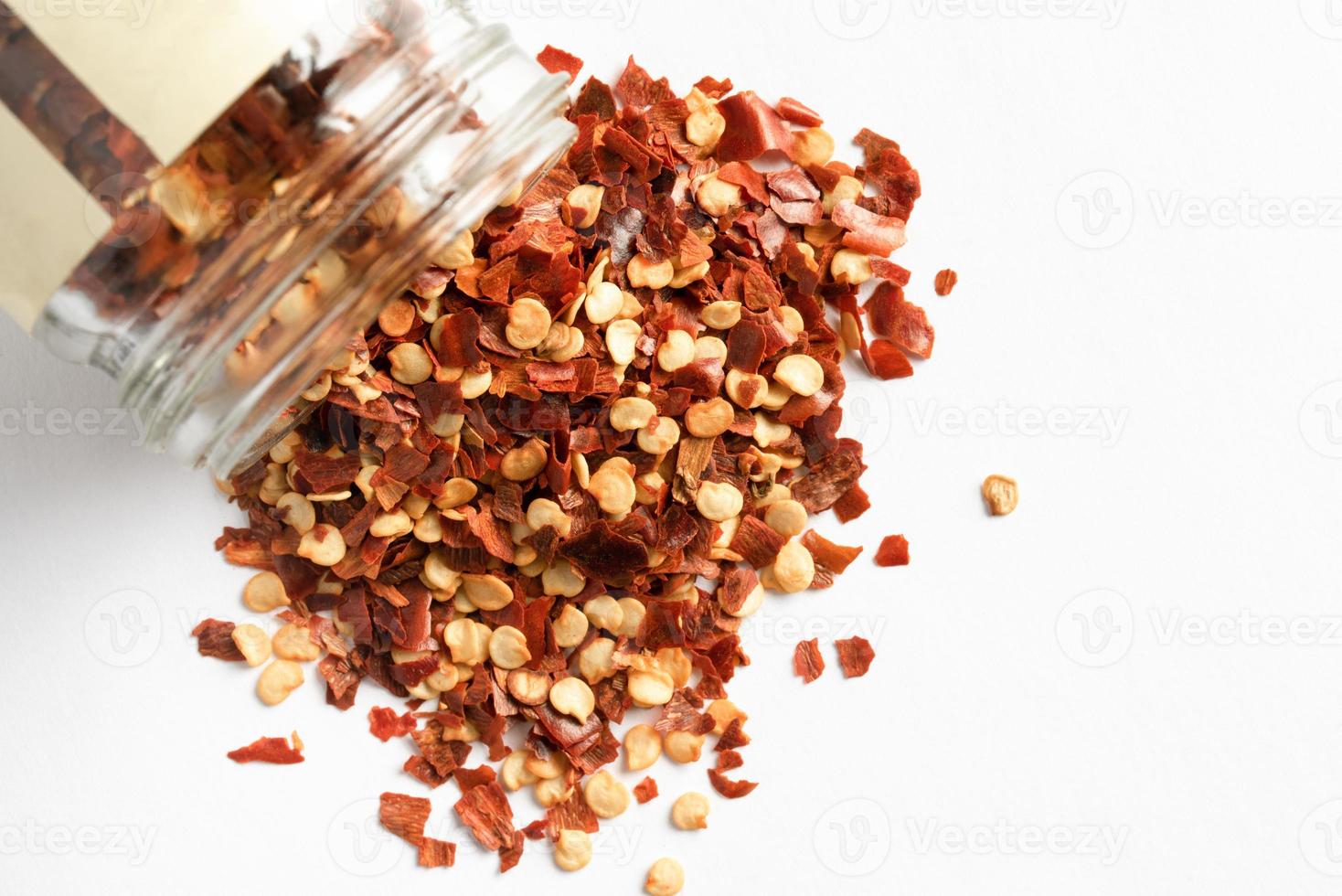 Red Pepper Flakes Spilled from a Jar 14557235 Stock Photo at Vecteezy