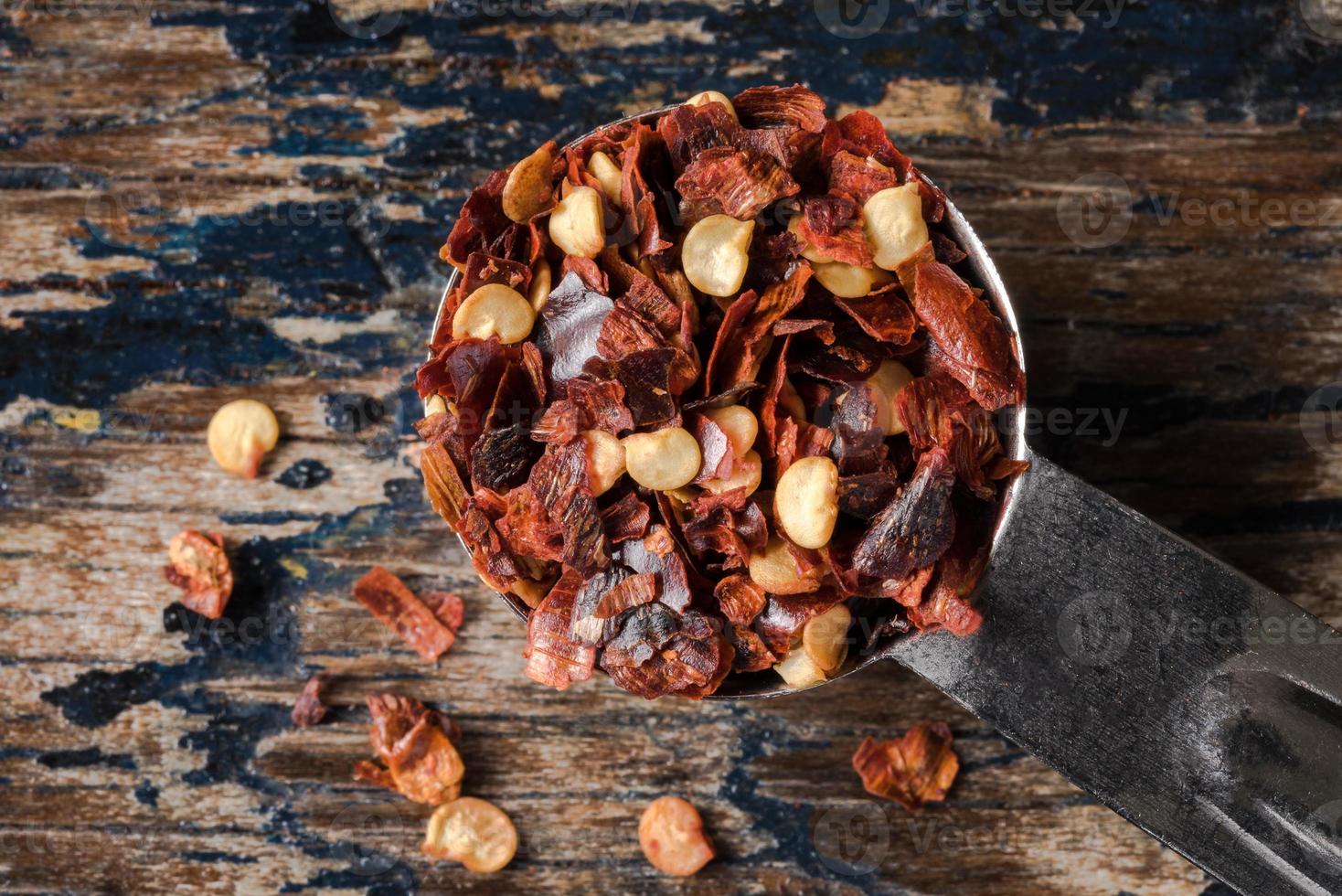 Red Pepper Flakes Spilled from a Teaspoon photo