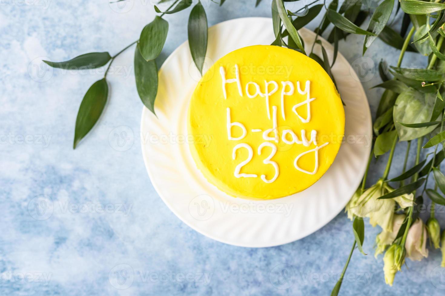 Small bento cake with inscription Happy b-day 23 as gift for the birthday. Korean style cake for one person. A sweet surprise dessert for a loved one. photo