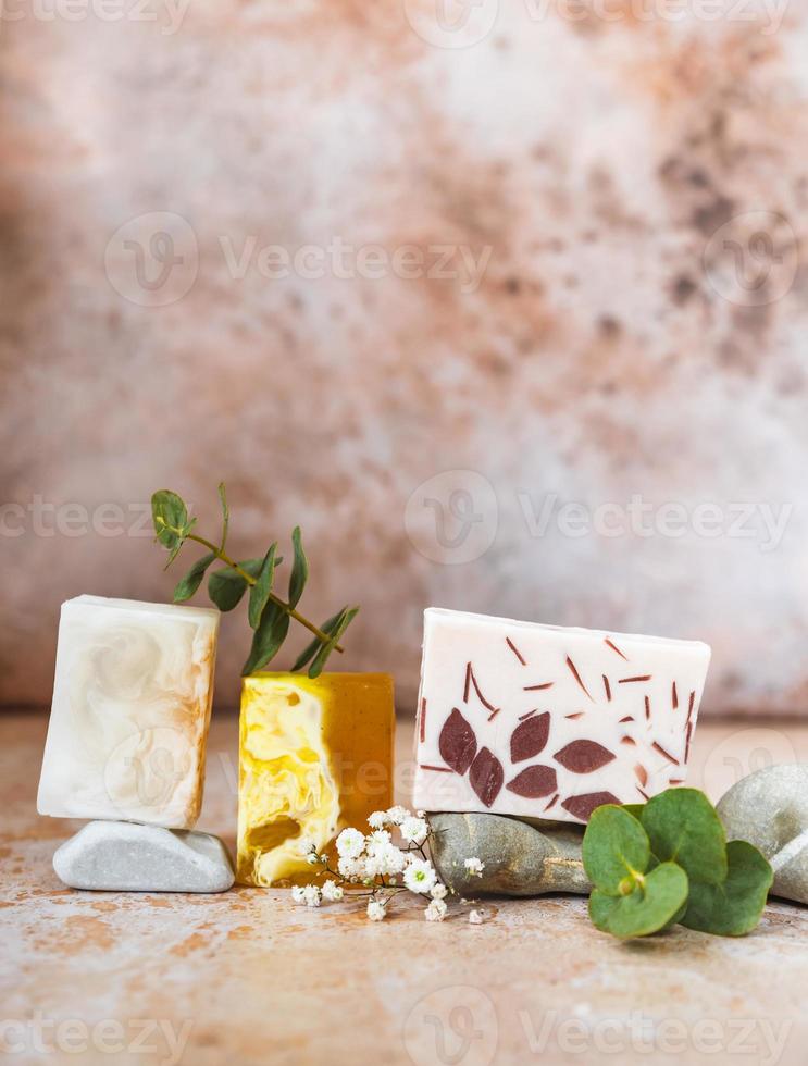 Natural organic soap bars. Homemade cosmetics, eco-friendly spa, beauty skincare concept. Small business, ethical shopping idea. Pastel minimal composition. photo