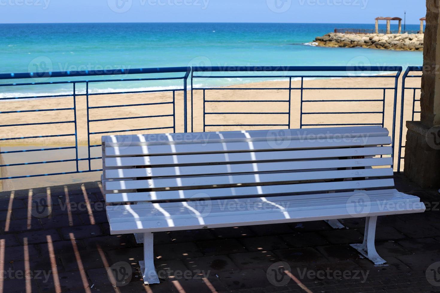 Bench for rest in a city park in Israel. photo