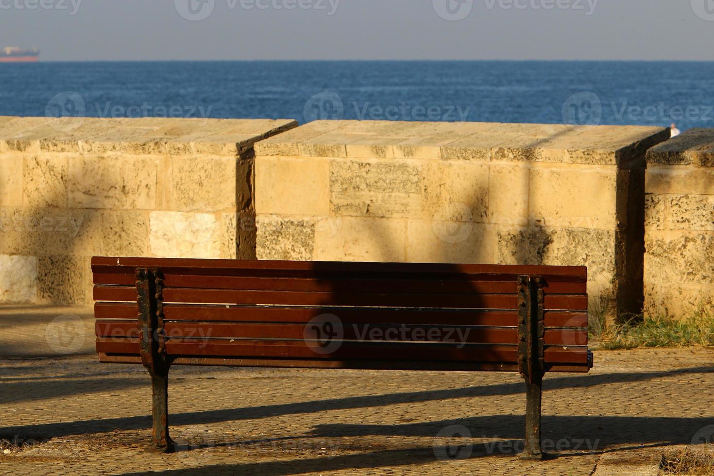 Bench for rest in a city park in Israel. photo