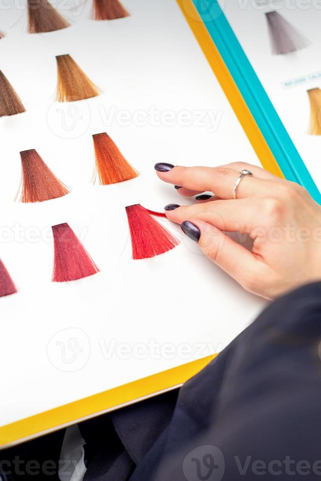 Choosing pink or red colour for hair colouring photo