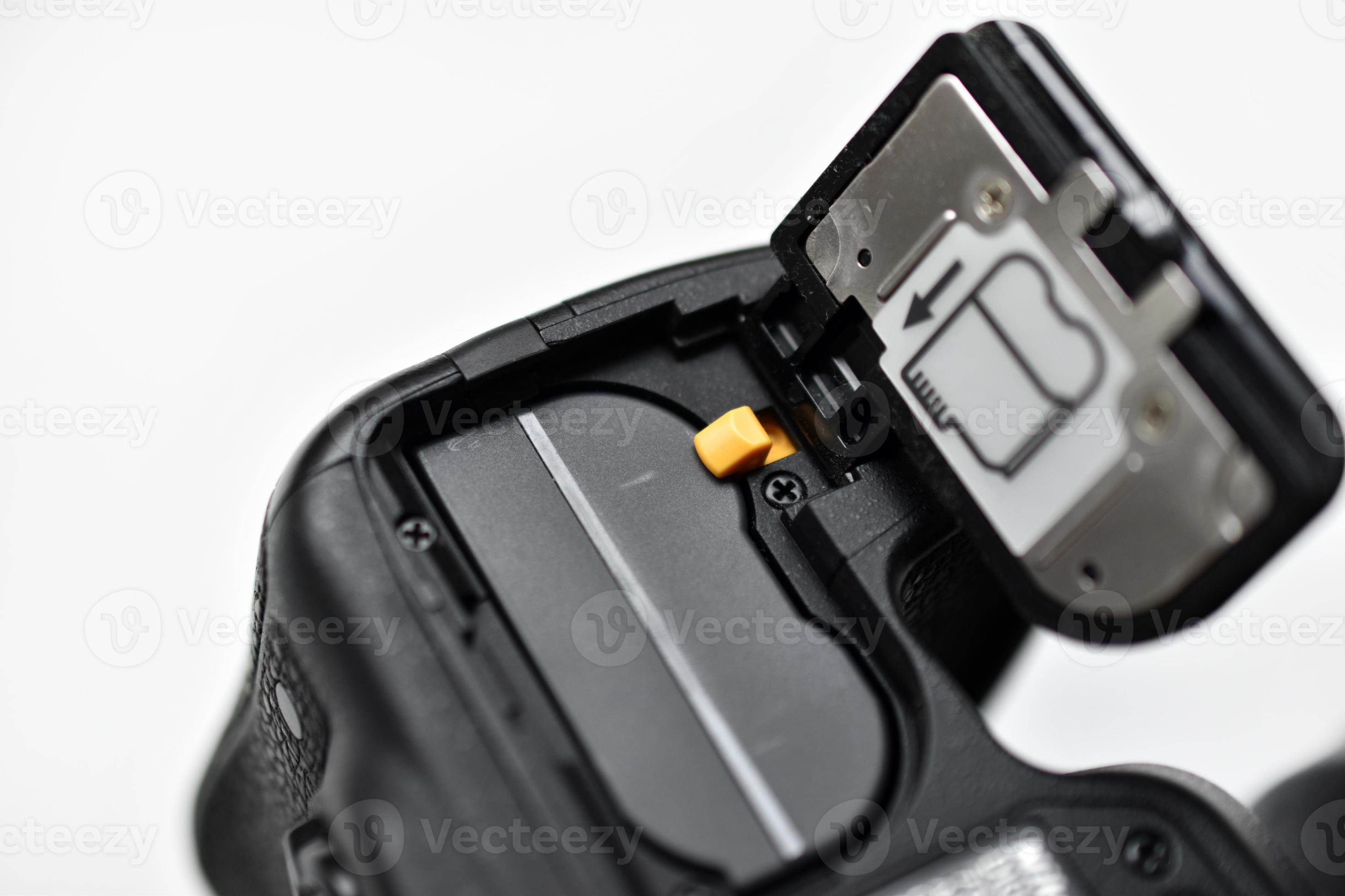 The battery of the SLR camera. Changing the camera battery in closeup