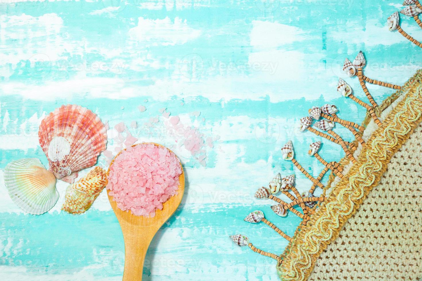 Beach bag with a spoon of sea salt and shells on a birch background. Beauty and spa. Flat lay. Copy space photo