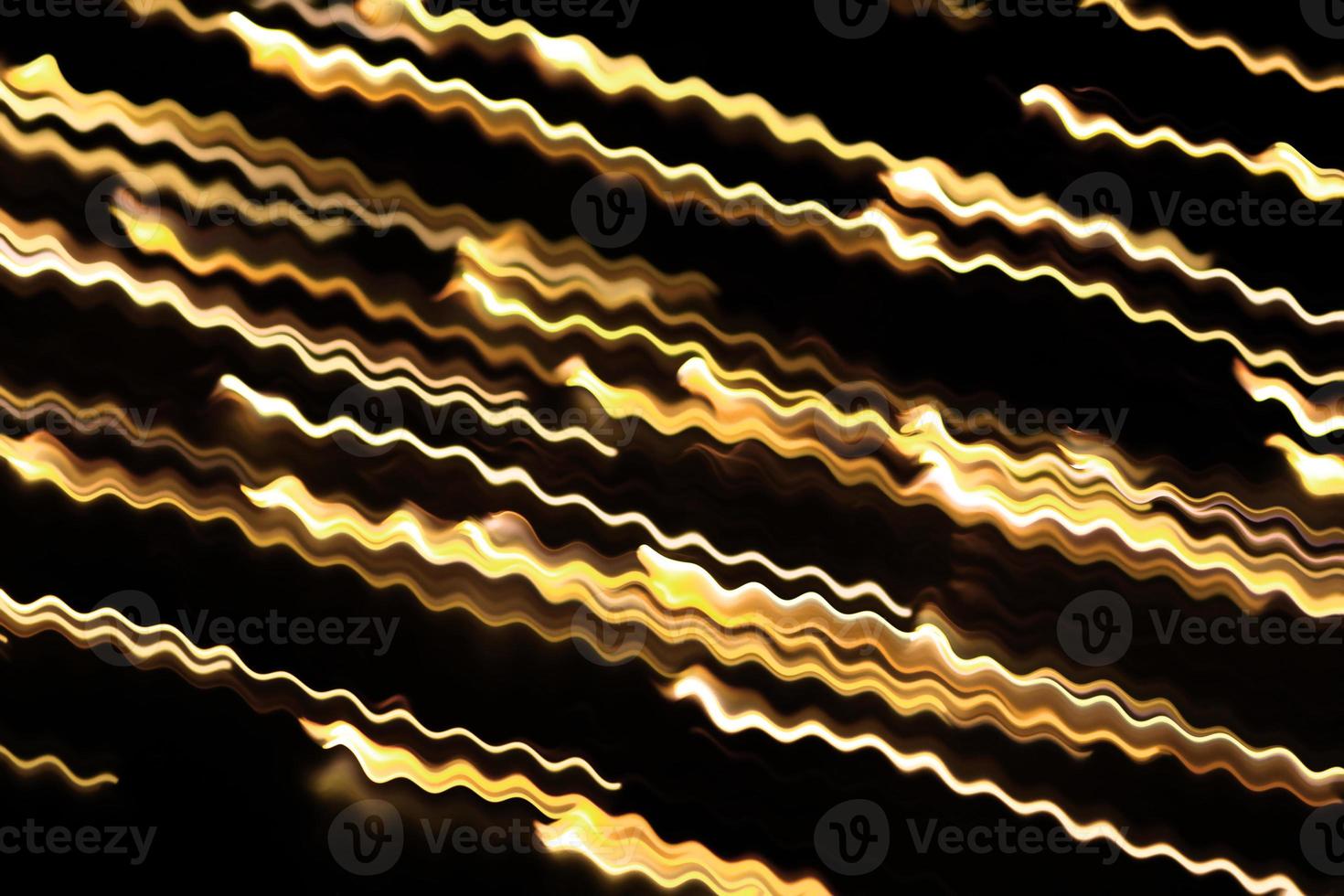 Yellow glowing swirl wave, fire light effect, line, lightning electric discharge. Twisted yellow glowing wavy curves. Technology, data flow on black isolated background photo