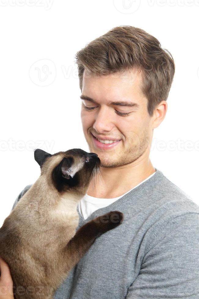 young man with siamese cat photo