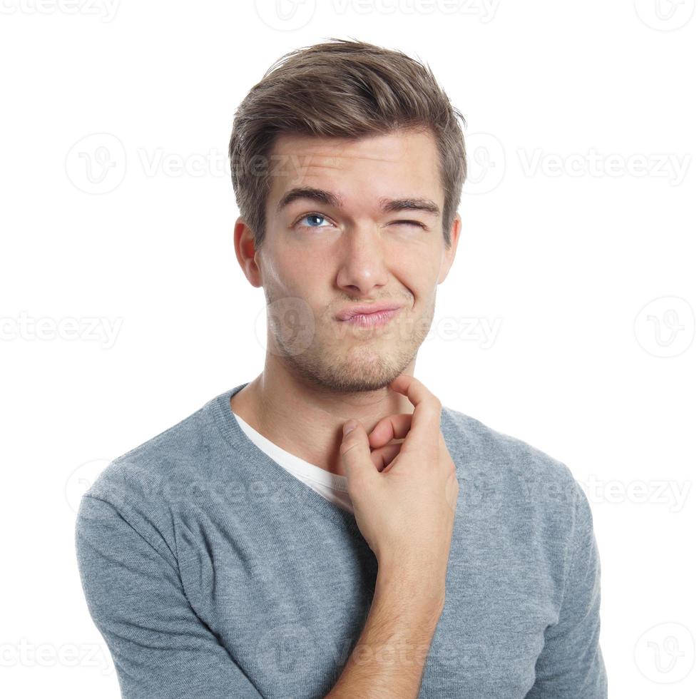 young man scratching his head photo