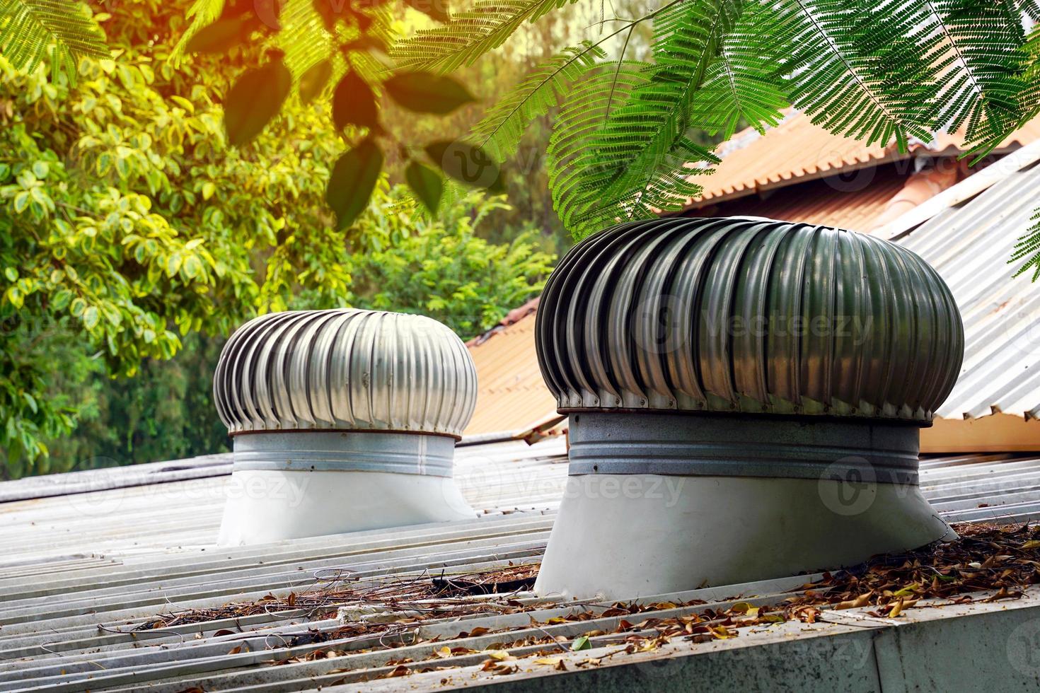 Roof Ventilator installed on the roof of the building to release heat inside the building to work outside the building by using natural wind without using electric power. photo