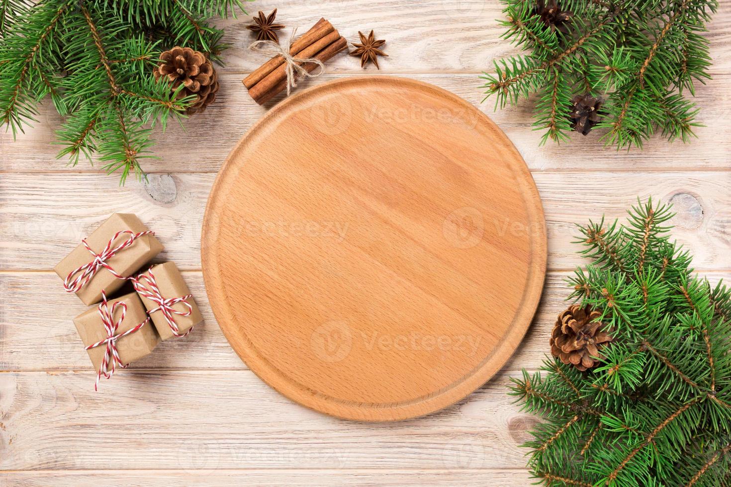 pizza cutting board at table background with christmas decoration, Round board. New Year concept photo