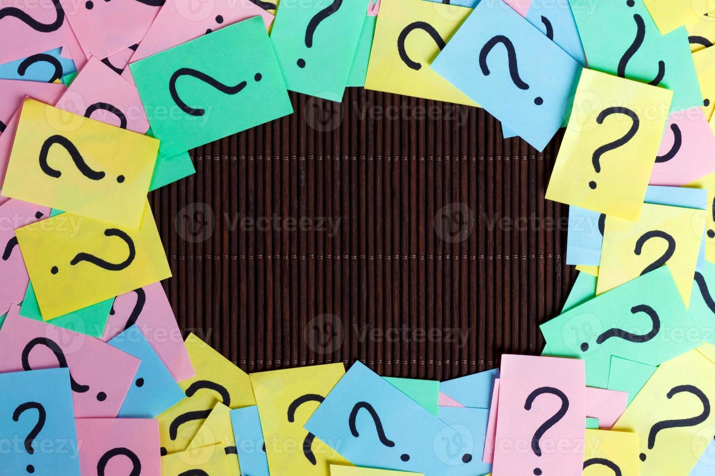 colorful question marks frame background written reminders tickets. ask or business concept with copy space photo