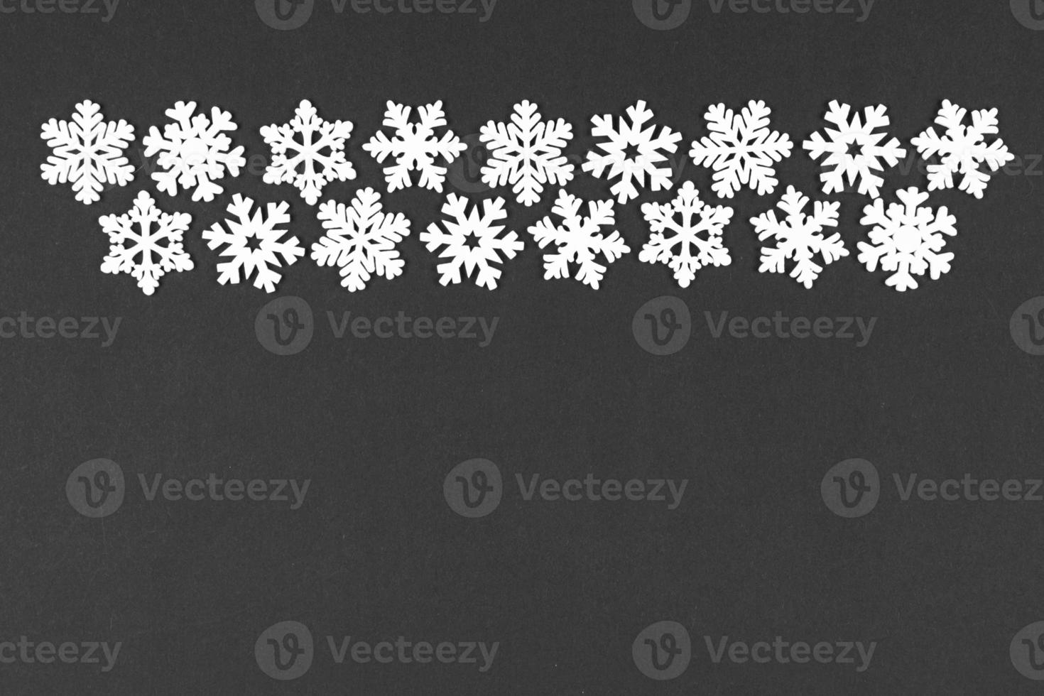 Top view of winter ornament made of white snowflakes on colorful background. Happy New Year concept with copy space photo