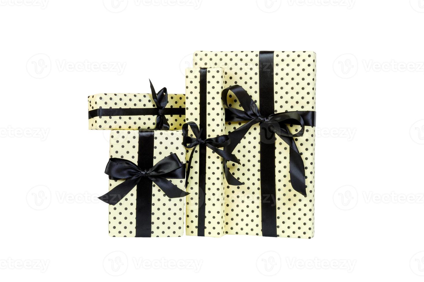 Set of Christmas or other holiday handmade present in yellow paper with black ribbon. Isolated on white background, top view. thanksgiving Gift box concept photo