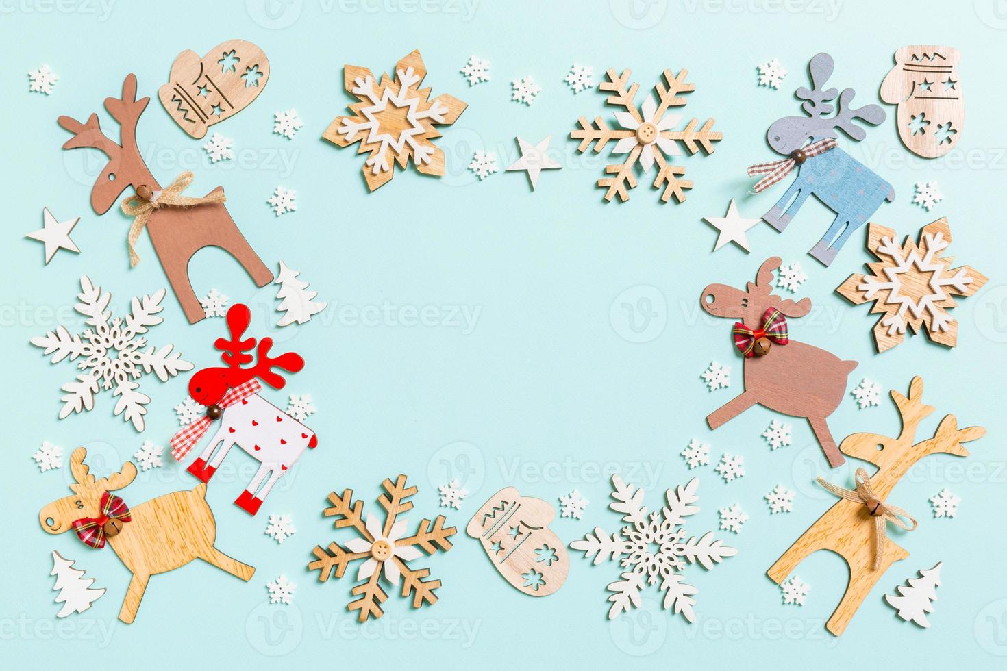 Top view of holiday decorations and toys on blue background. Christmas ornament concept with empty space for your design photo
