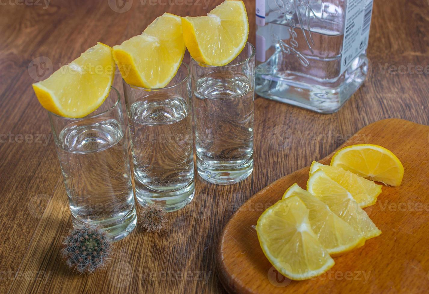 Tequila shot with lime, selective focus photo