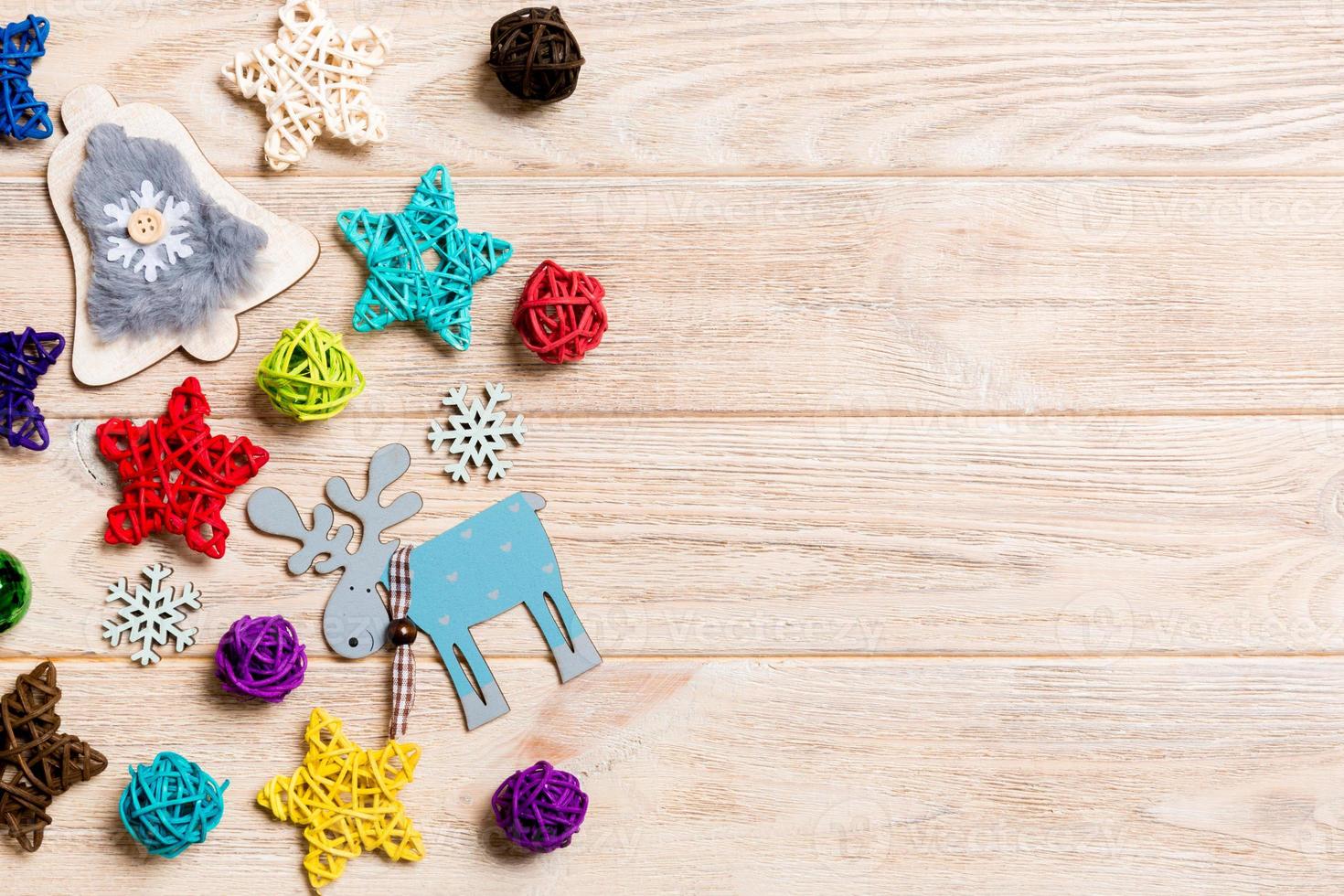 Top view of Christmas decorations and toys on wooden background. Copy space. Empty place for your design. New Year concept photo
