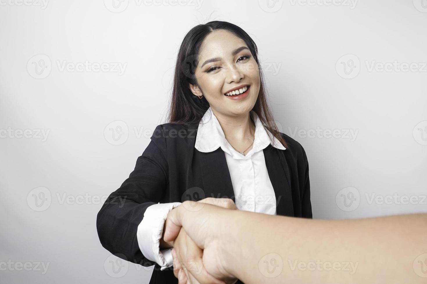 Asian businesswoman shaking hands after a successful job interview at the office. photo