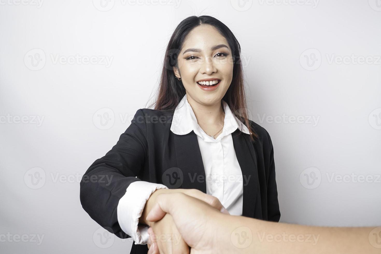 Asian businesswoman shaking hands after a successful job interview at the office. photo