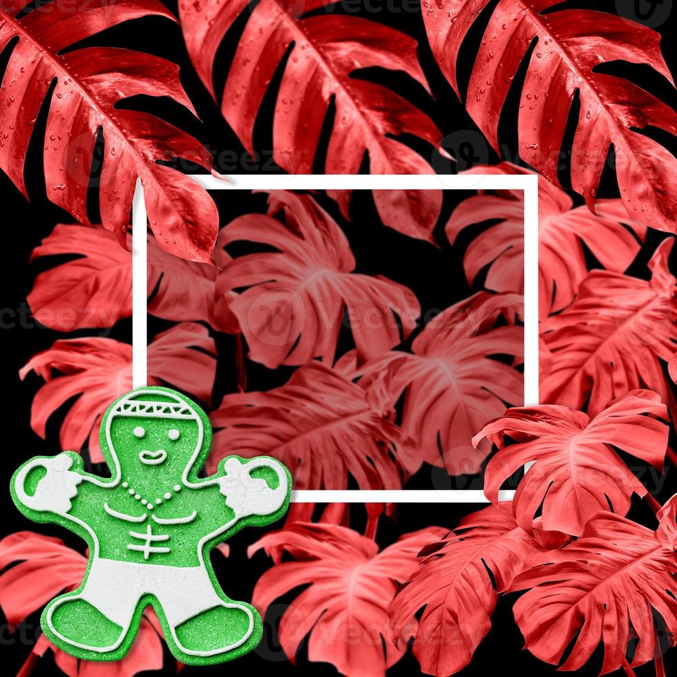 snowflake-shaped and doll with colorful monstera leaves pattern on black background for christmas and new year concept photo