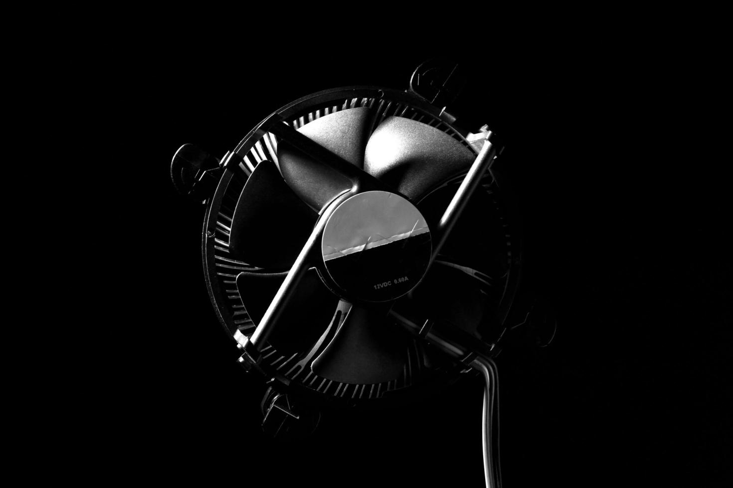 computer heatsink fan on dark background photo