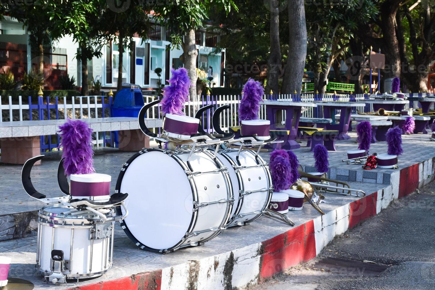 Marching band drums on floor near street inside secondary school for preparing sport parade walking of students, soft and selective focus. photo