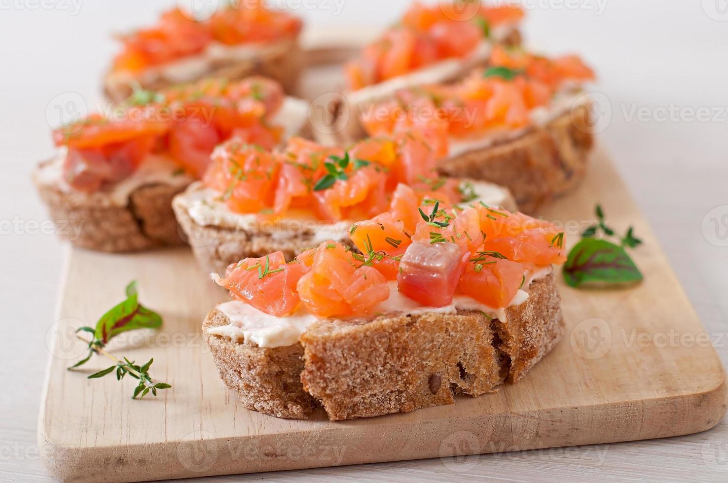 Sandwich with salted salmon and cream cheese. photo