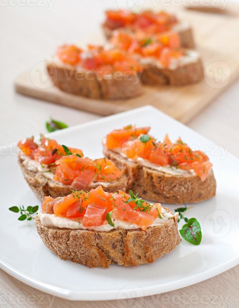 Sandwich with salted salmon and cream cheese. photo