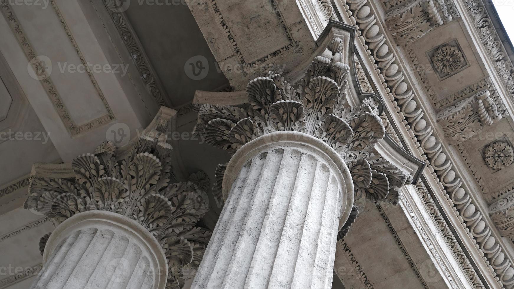 Classic architectural column. Details of the architecture of a historical building. Element of exterior building with columns and Stucco molding on the ceiling of Cathedral in St. Petersburg, Russia. photo