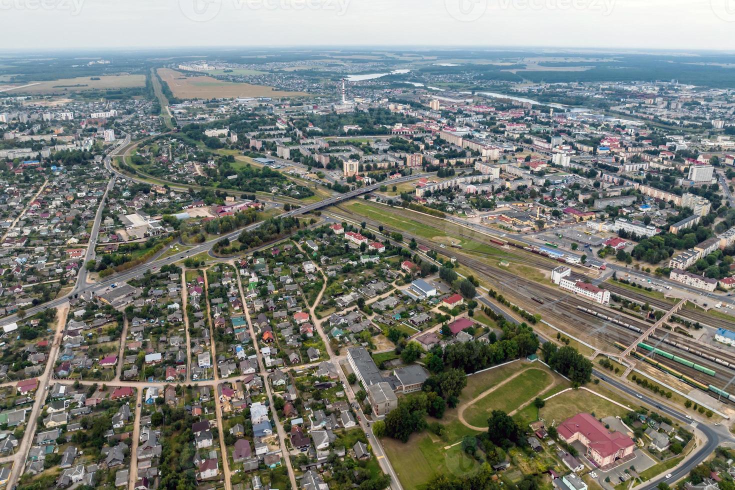 aerial panoramic view from great height of provincial town with a private sector and high-rise urban apartment buildings photo