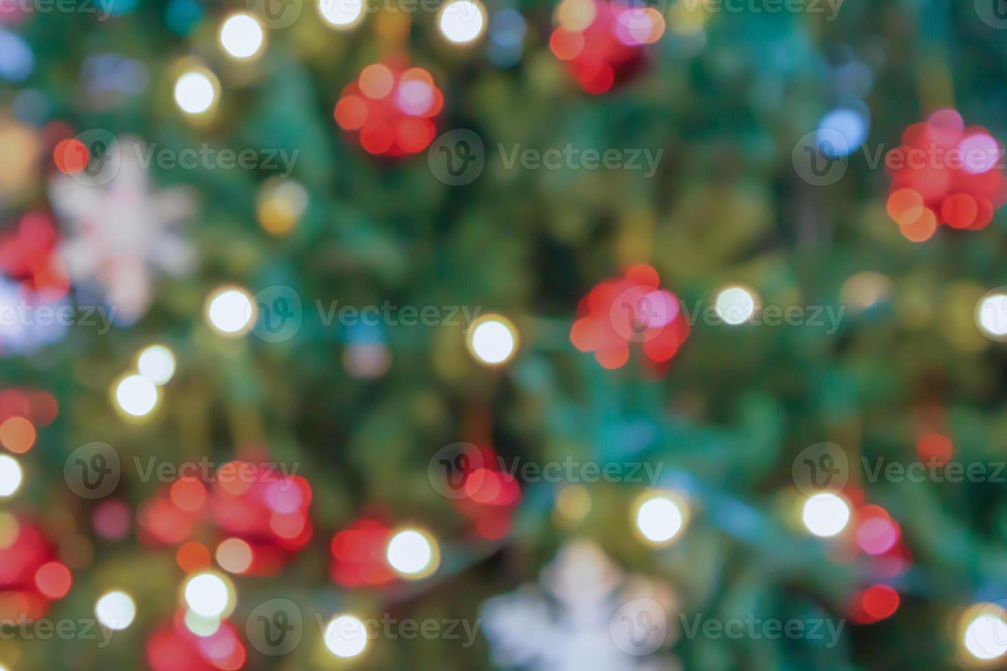 Abstract blurred christmas tree with bokeh light background photo