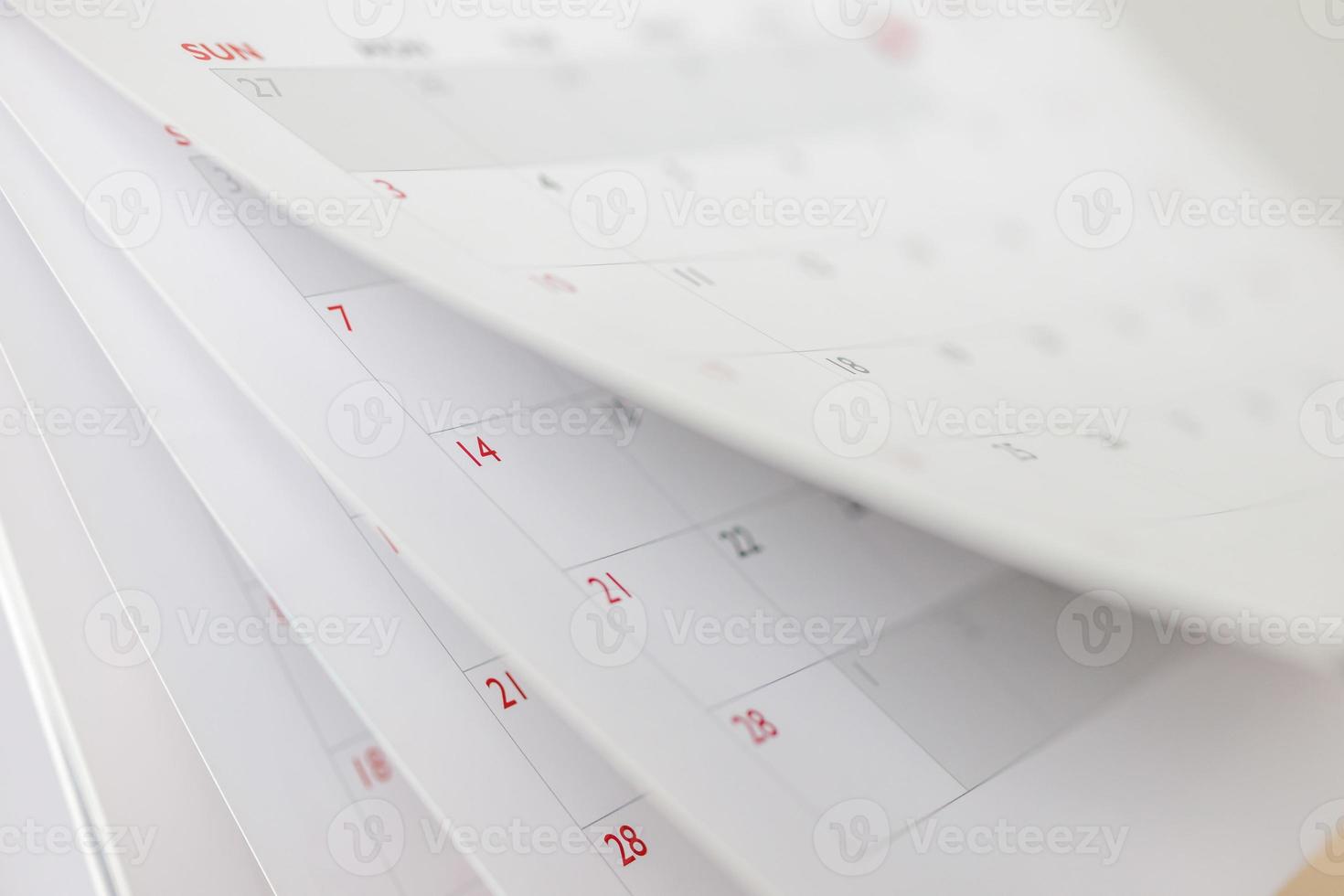 Calendar page flipping sheet close up blur background business schedule planning appointment meeting concept photo