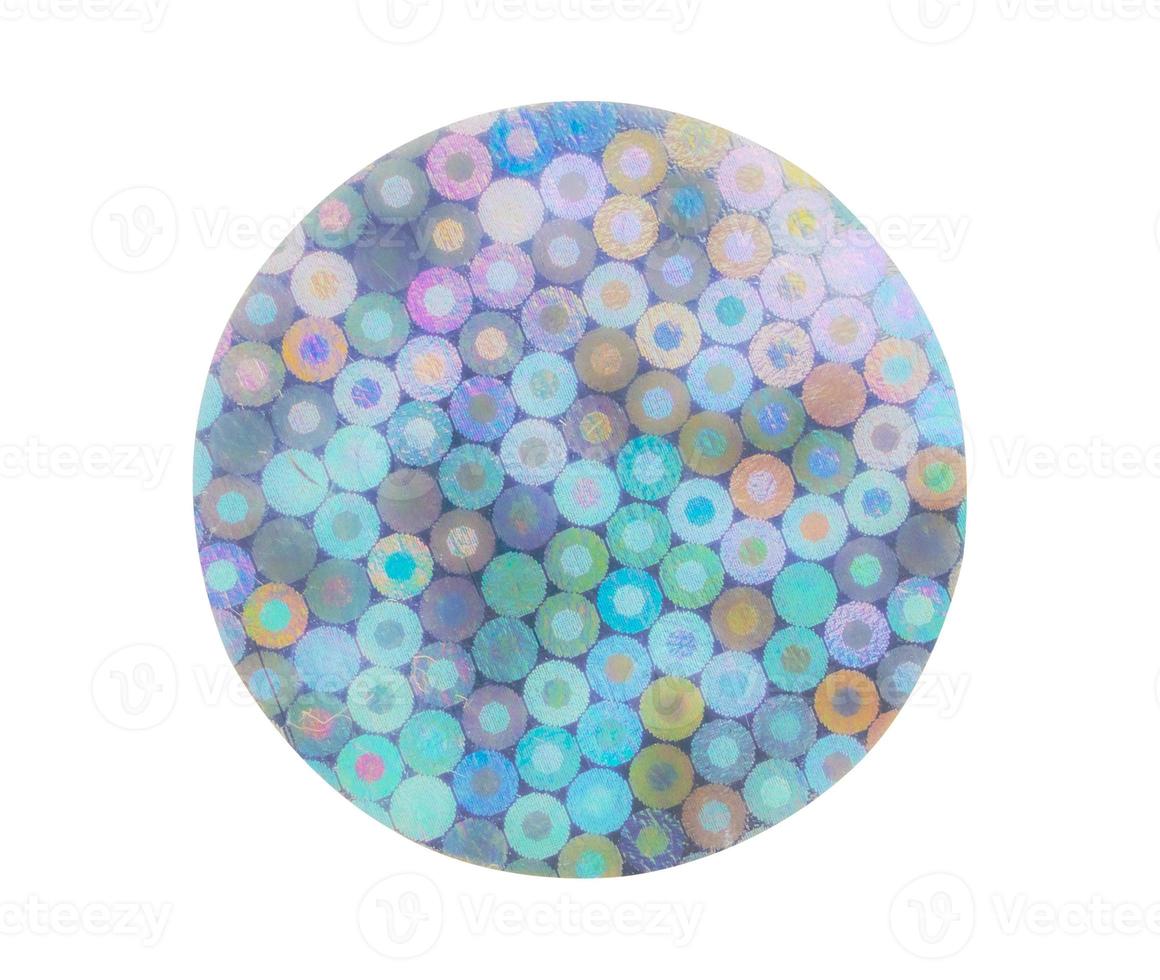 Blank round adhesive holographic foil sticker label isolated on white background photo