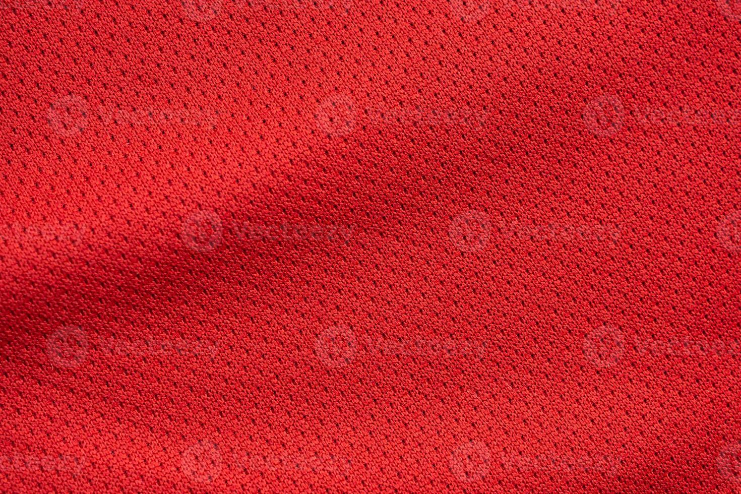 Red sports clothing fabric football jersey texture close up photo