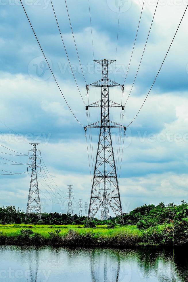 High-voltage transmission towers, complex steel structures in rural areas of Thailand. photo