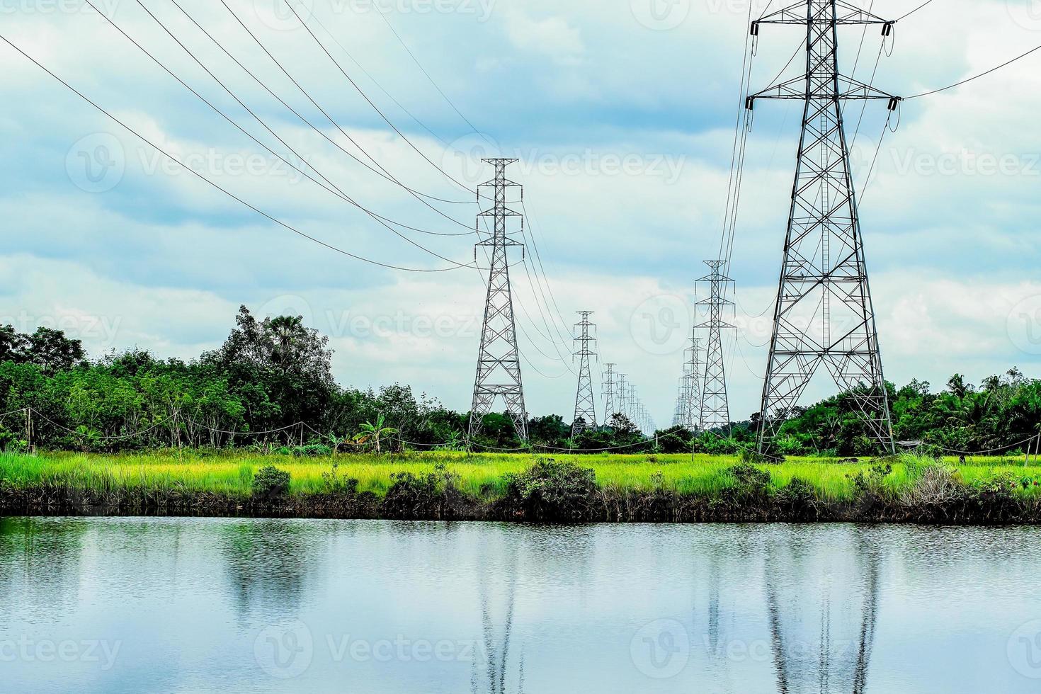 High-voltage transmission towers, complex steel structures in rural areas of Thailand. photo