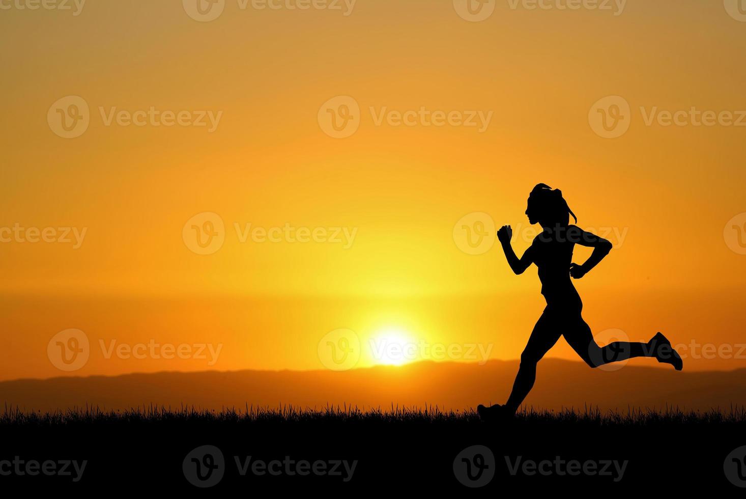 people jogging in the meadow in the evening photo