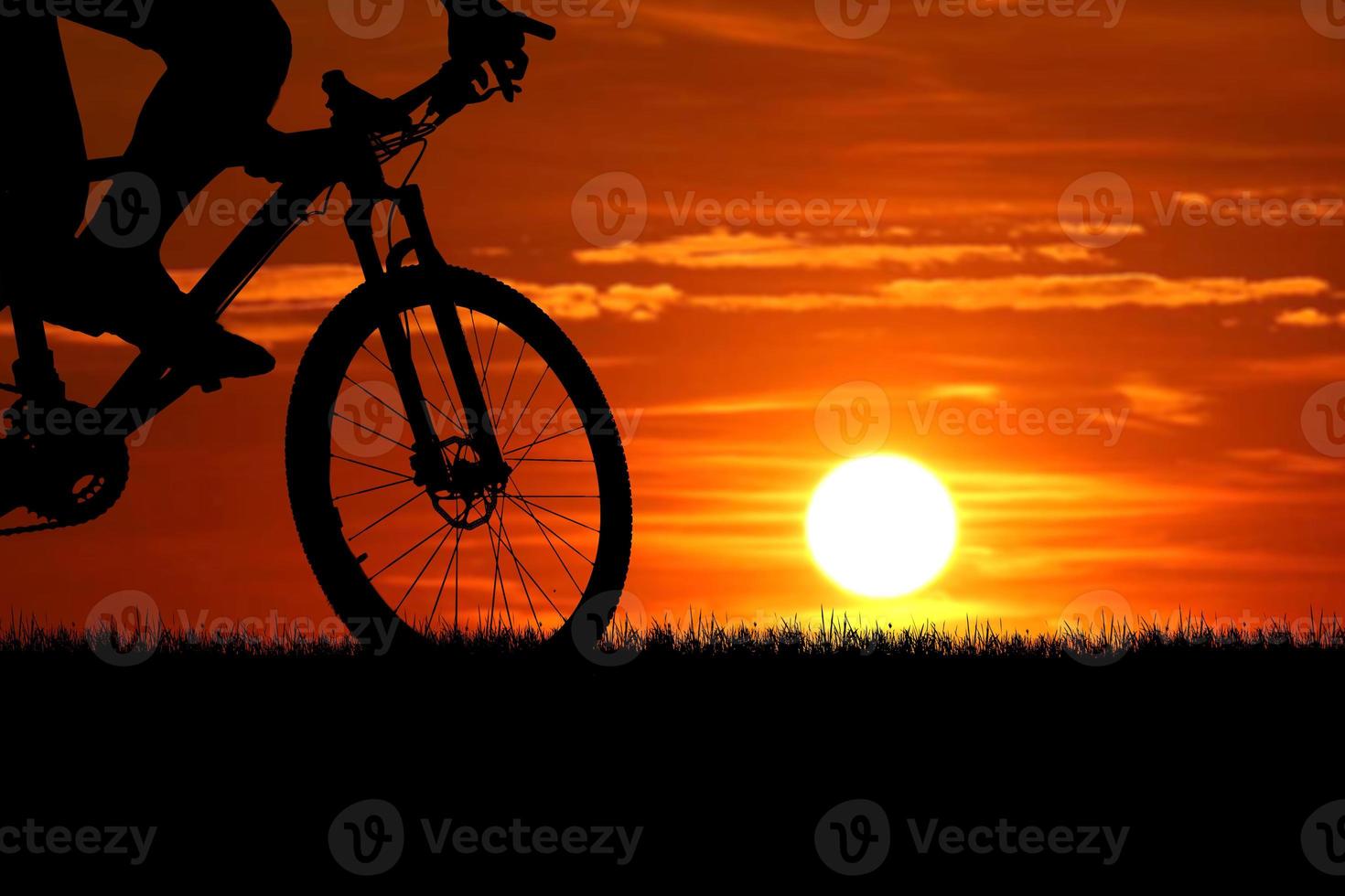 Mountain bike silhouette with beautiful views. photo