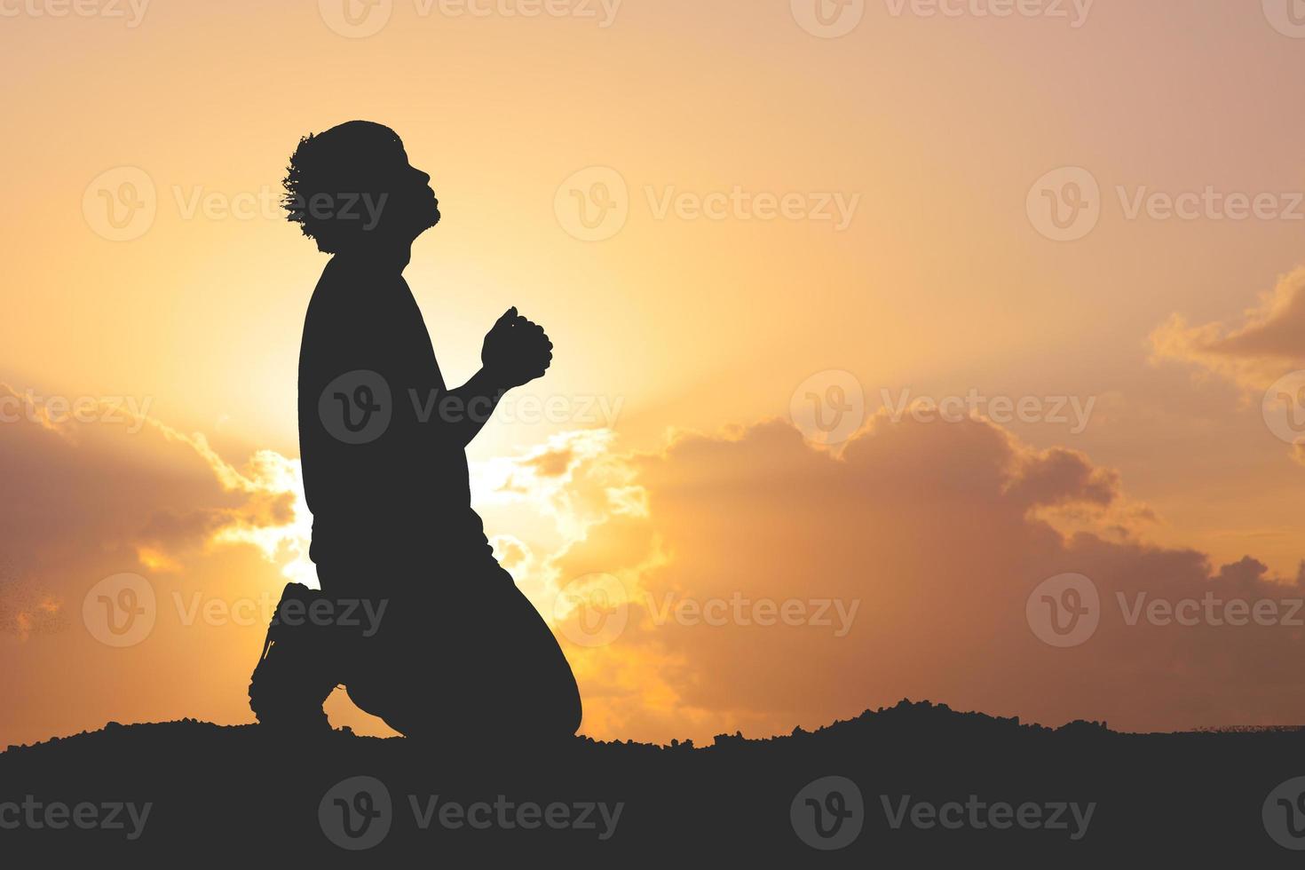 man praying for blessings from god. A lonely, heartbroken, unemployed and hopeless man. photo