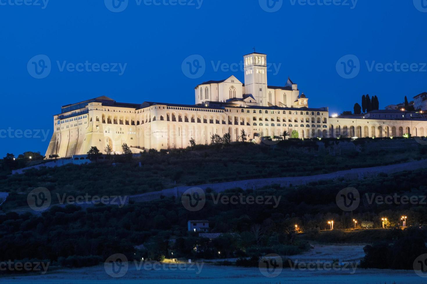 Assisi Basilica by night,  Umbria region, Italy. The town is famous for the most important Italian Basilica dedicated to St. Francis - San Francesco. photo