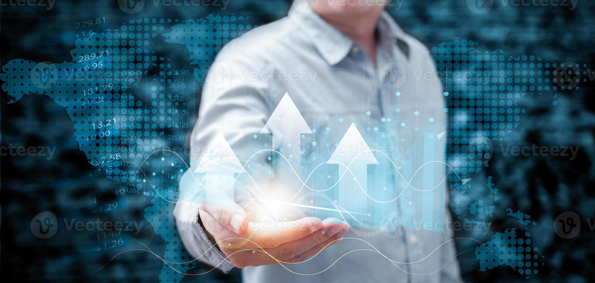Businessmen hold growth graphs and progress of business and analyze financial, and investment.Use technology to plan strategy to success goals and growth.online business, e-commerce, online marketing. photo