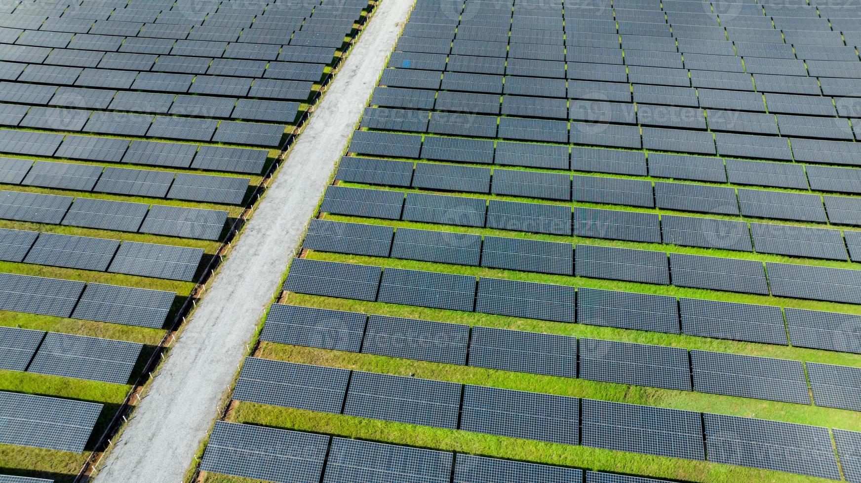 Aerial view of solar farm. Solar power for green energy. Sustainable resources. Solar cell panels use sun light as a source to generate electricity. Photovoltaics or PV. Sustainable renewable energy. photo