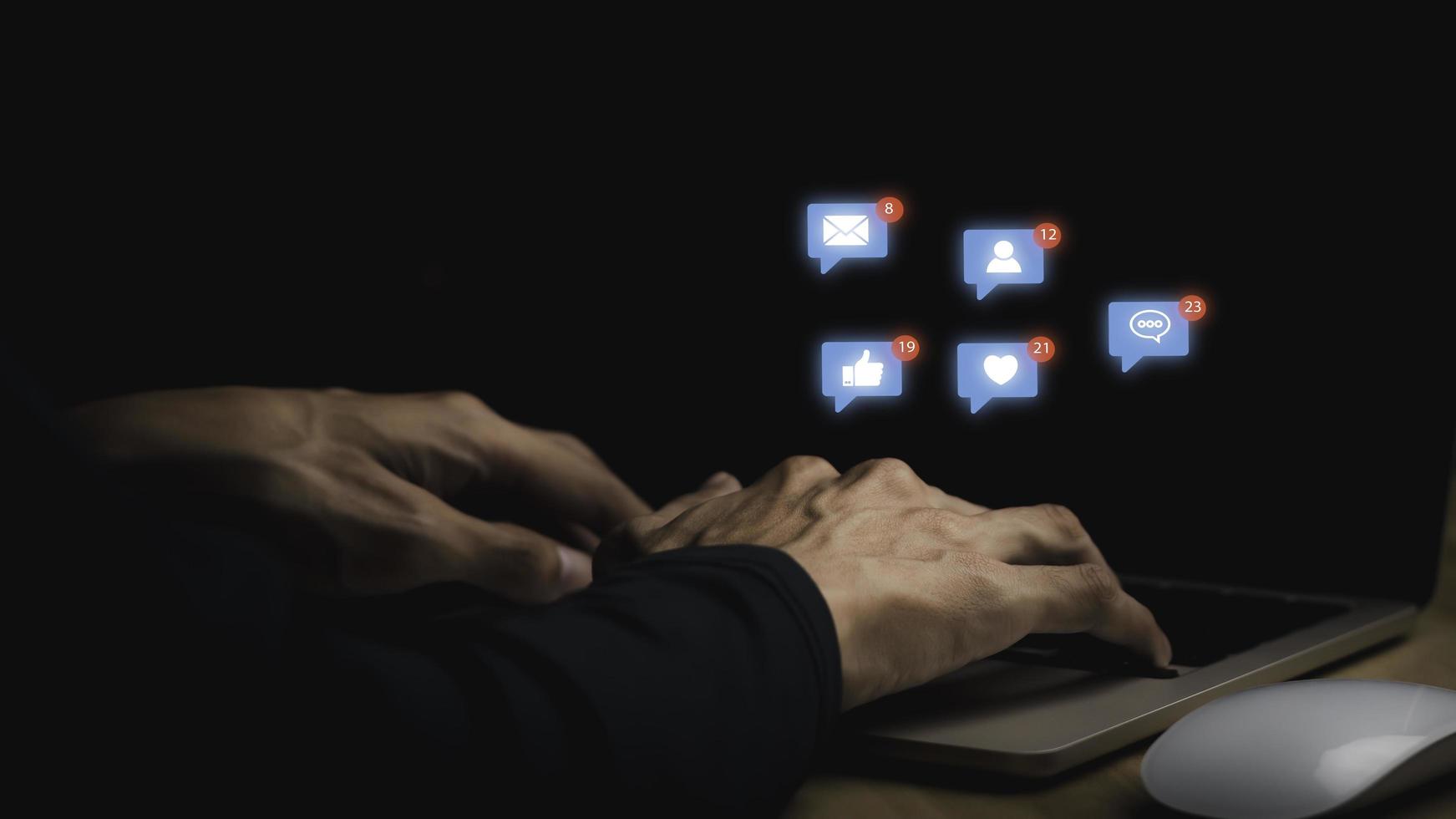 Concept with notification icons of like being happy.and social media interactions on laptop,message, email, comment ,businessman hands holding device,smartphone, internet digital marketing. photo