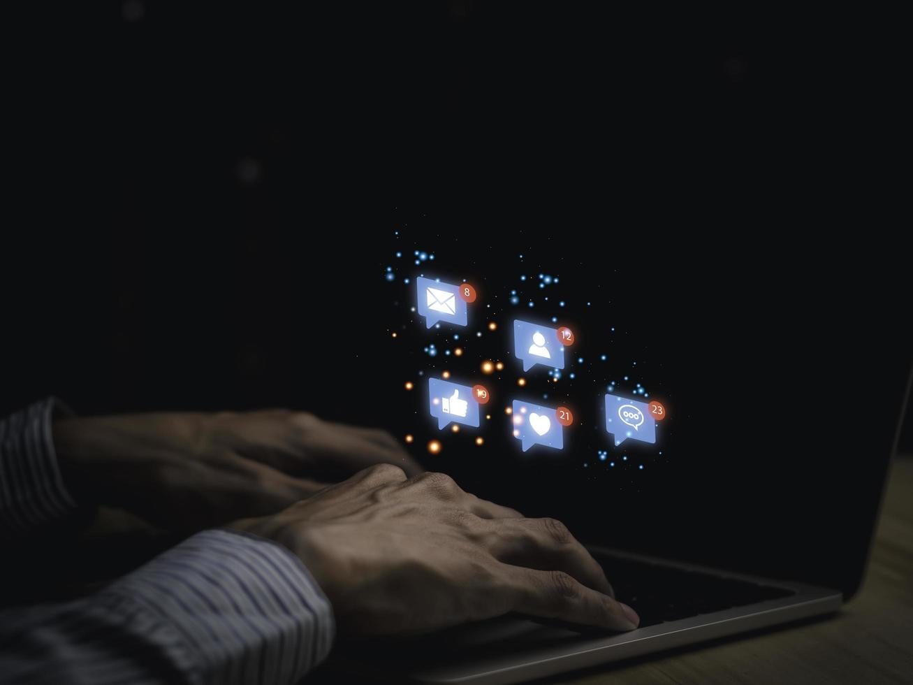 Concept with notification icons of like being happy.and social media interactions on laptop,message, email, comment ,businessman hands holding device,smartphone, internet digital marketing. photo