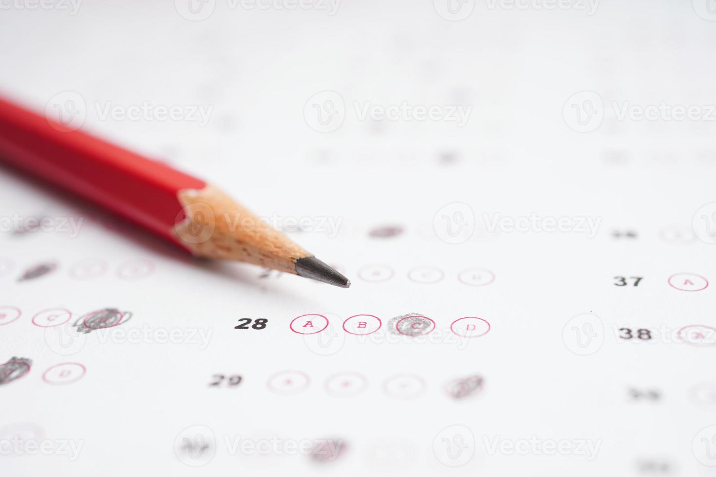 Answer sheets with pencil drawing fill to select choice, education concept. photo