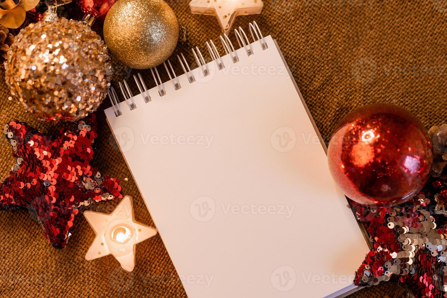 notebook with blank pages with New Year's toys, gifts and numbers 2023. Plans and dreams for the New Year, space for text photo