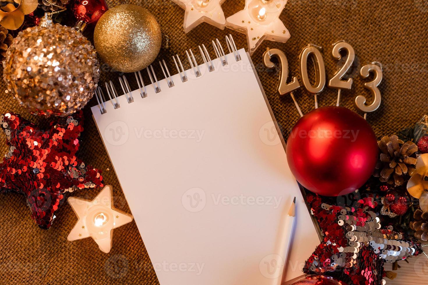 notebook with blank pages with New Year's toys, gifts and numbers 2023. Plans and dreams for the New Year, space for text photo