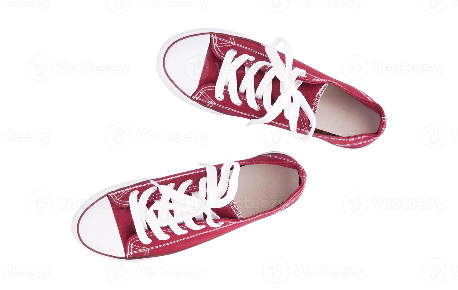 Red sneakers top view isolated on white background photo